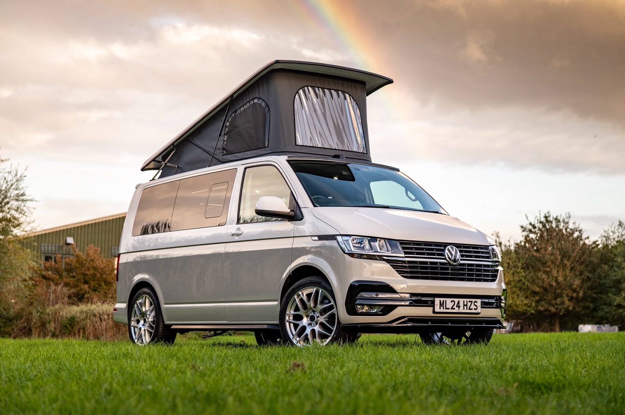 VW Transporter T6.1 with a Storm pop-top roof raised and Camper Glass side windows