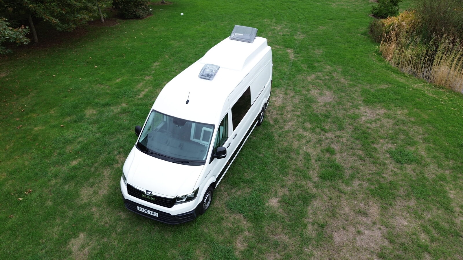 Front three-quarter view of a van with roof pod fitted